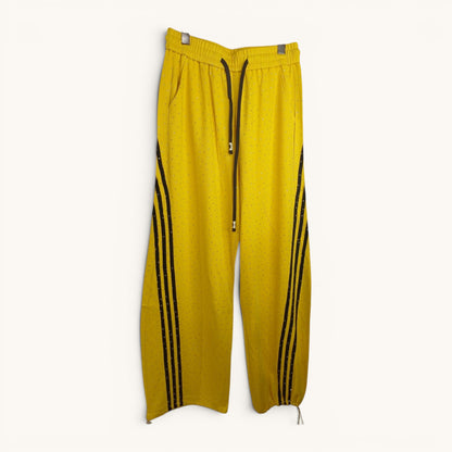 Buzo pantalon ancho con lineas laterales y piedritas