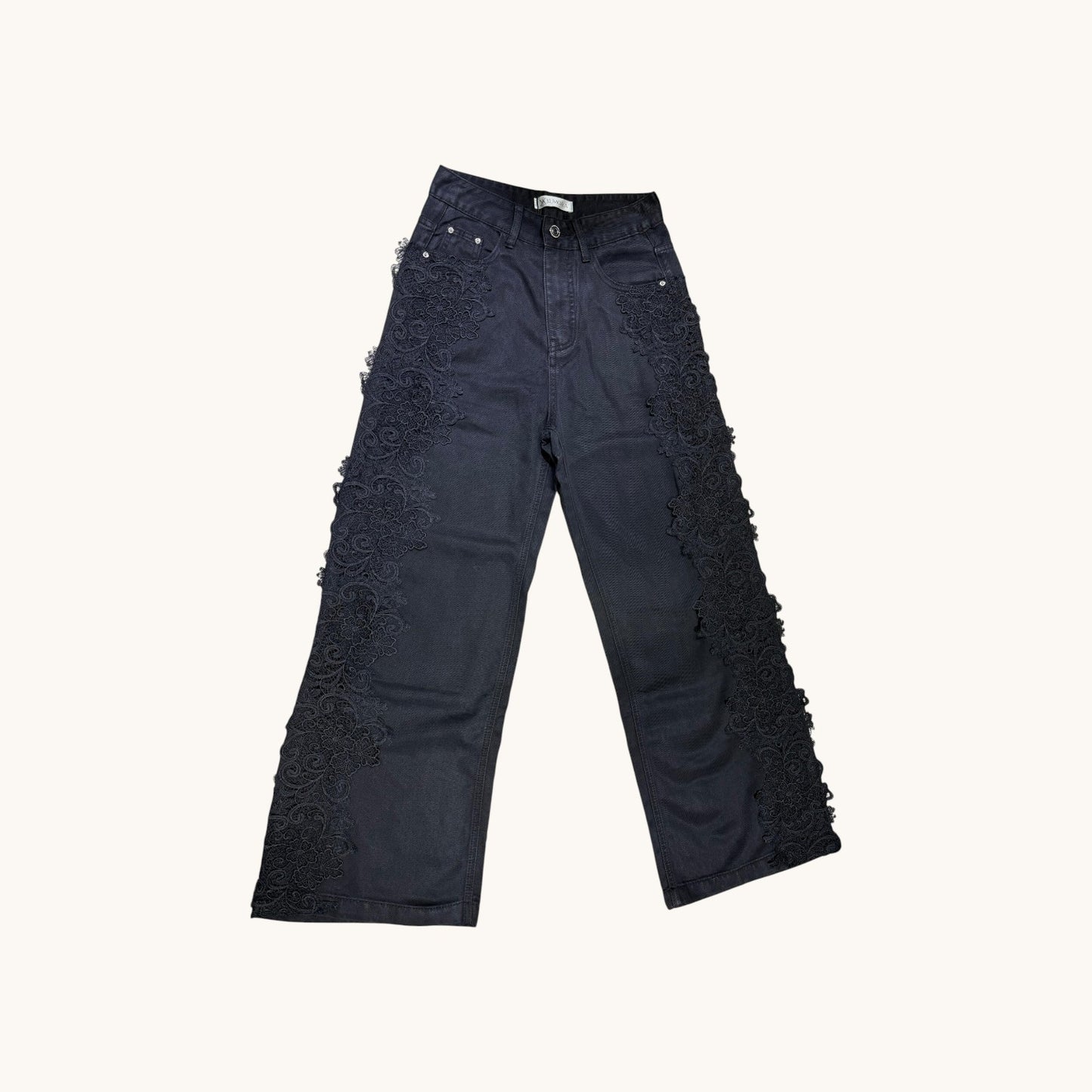 Pantalones con detalle floreado al lateral