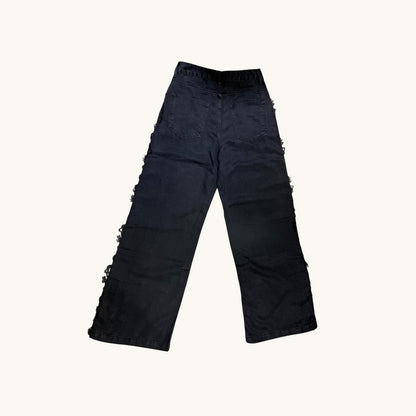 Pantalones con detalle floreado al lateral